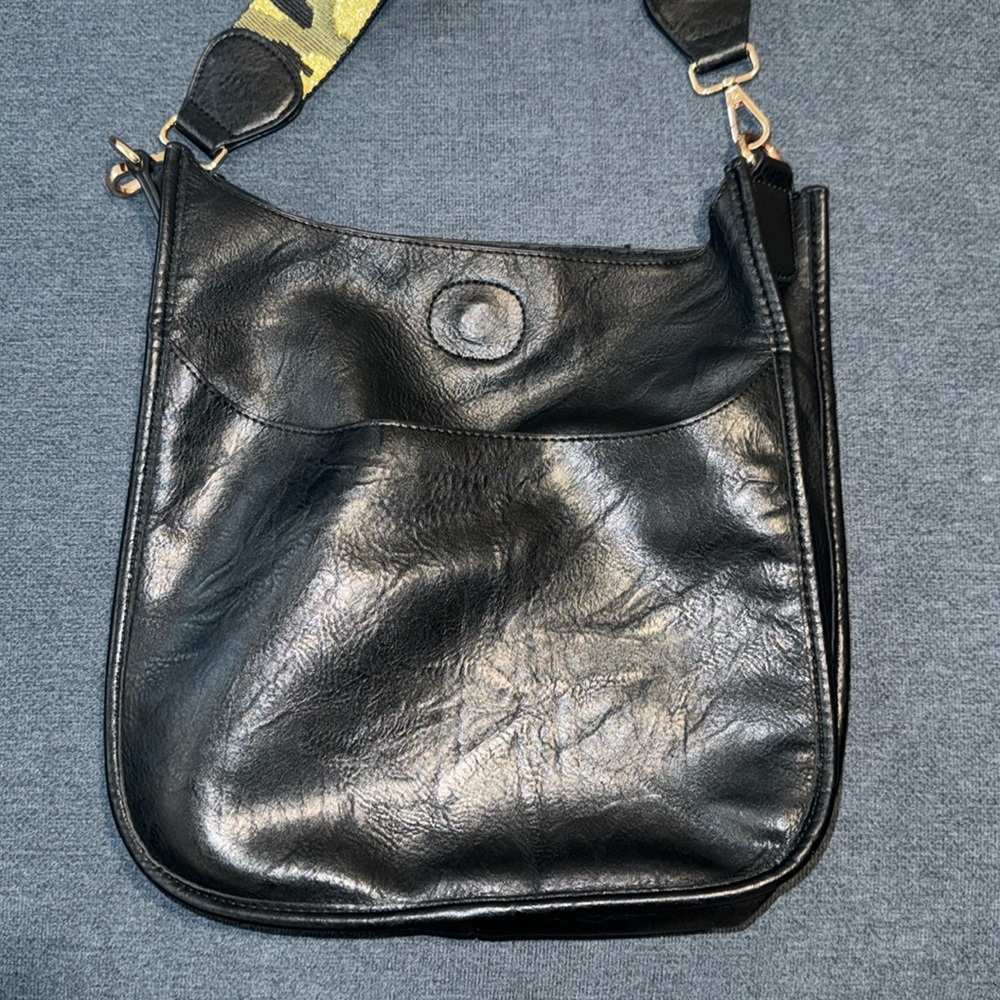 Black bag with camo strap